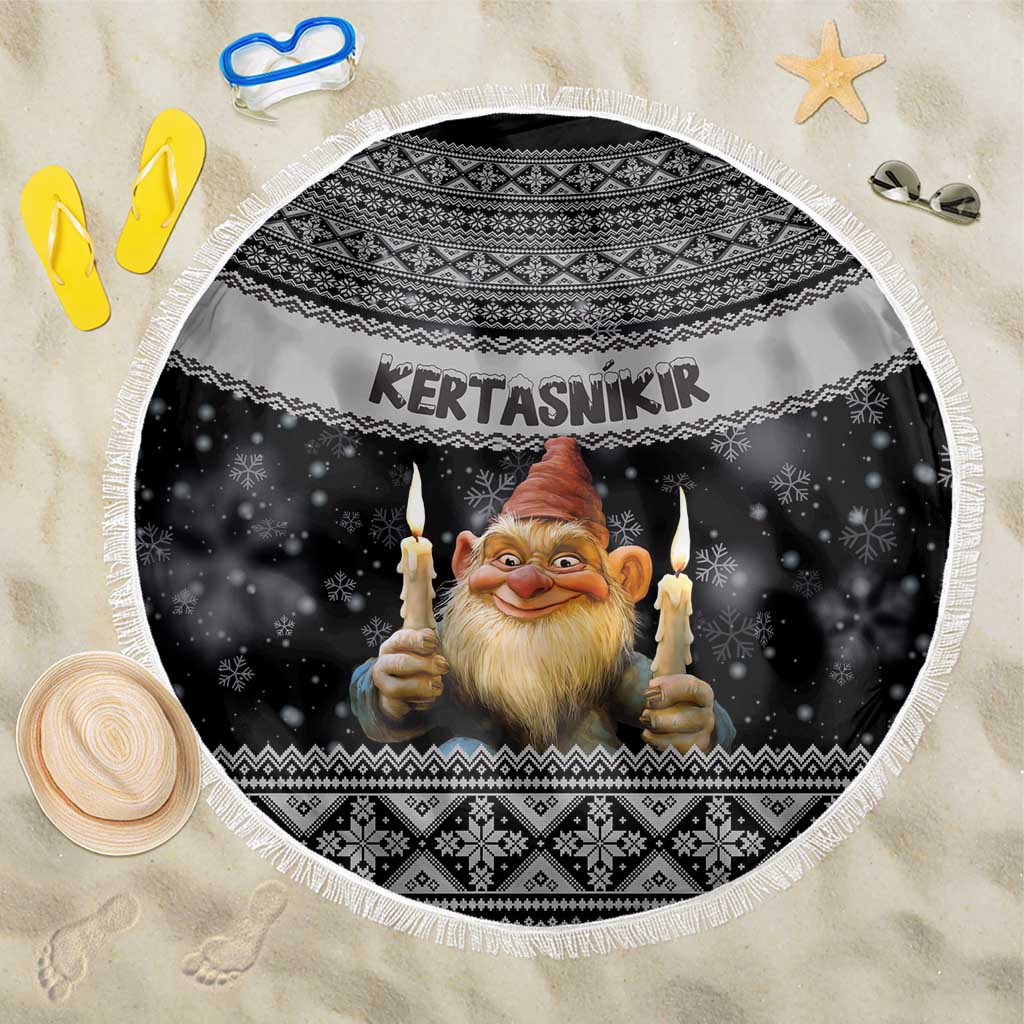 Round black beach blanket with white fringe, gnome holding candles and Nordic border pattern
