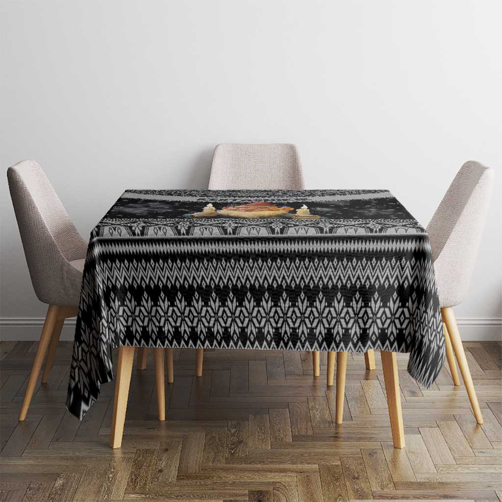 Black Nordic Christmas tablecloth with repeating geometric pattern on table surface