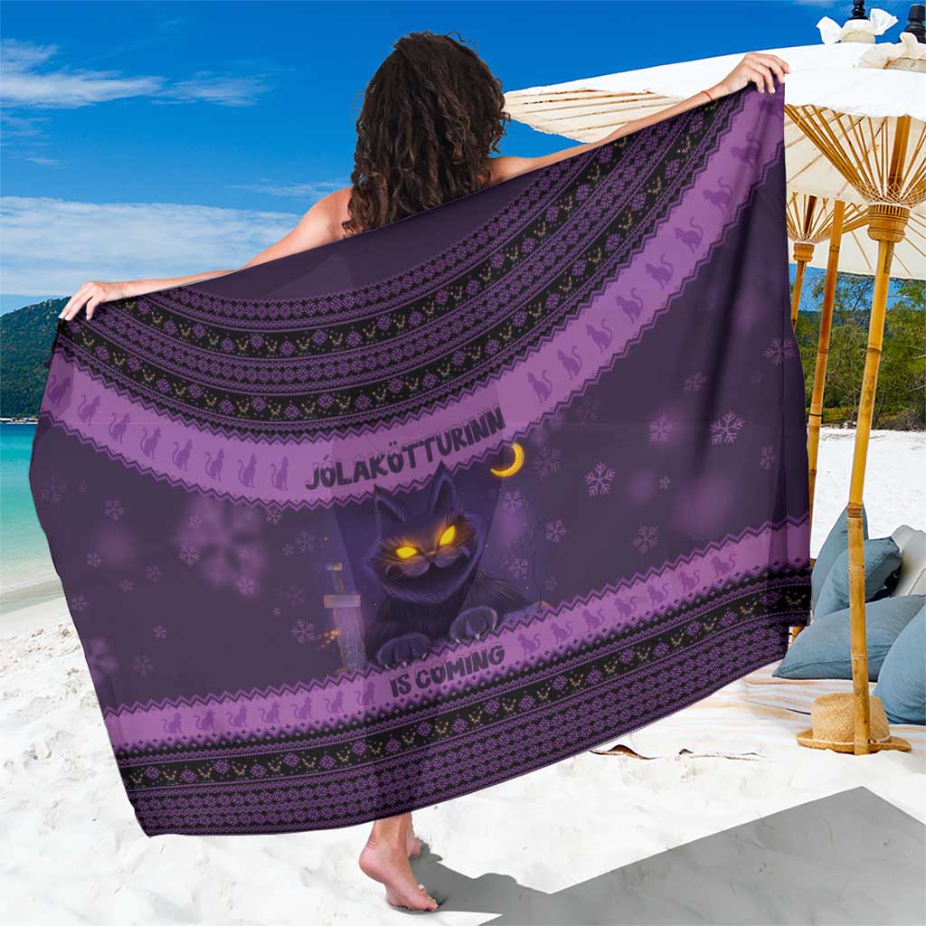 Dark purple Christmas cat sarong with Nordic border pattern and “IS COMING” print