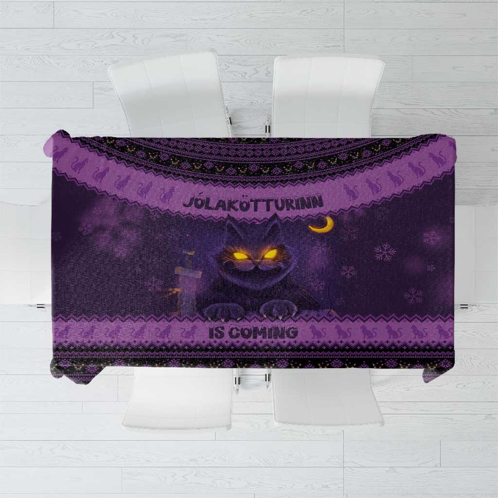 Dark purple Christmas tablecloth with glowing cat face and Nordic border pattern
