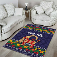 Dark blue Christmas area rug featuring God Jul text and red-and-yellow goat figure