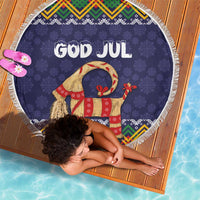 Round dark blue 'GOD JUL' beach blanket with fringe border and Scandinavian folk goat design