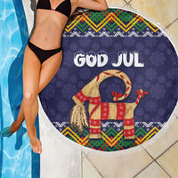 Round dark blue beach blanket with fringe edge, 'GOD JUL' goat, and red gift accents