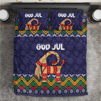 Dark blue Christmas bedding set with 'GOD JUL' text, red goat figure, and colorful folk border