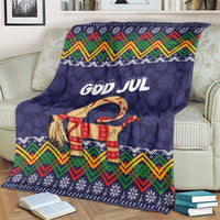 Dark blue Christmas blanket with GOD JUL lettering, goat graphic, and multicolor zigzag border