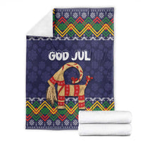 Dark blue Christmas blanket with goat and GOD JUL, zigzag and snowflake pattern edges