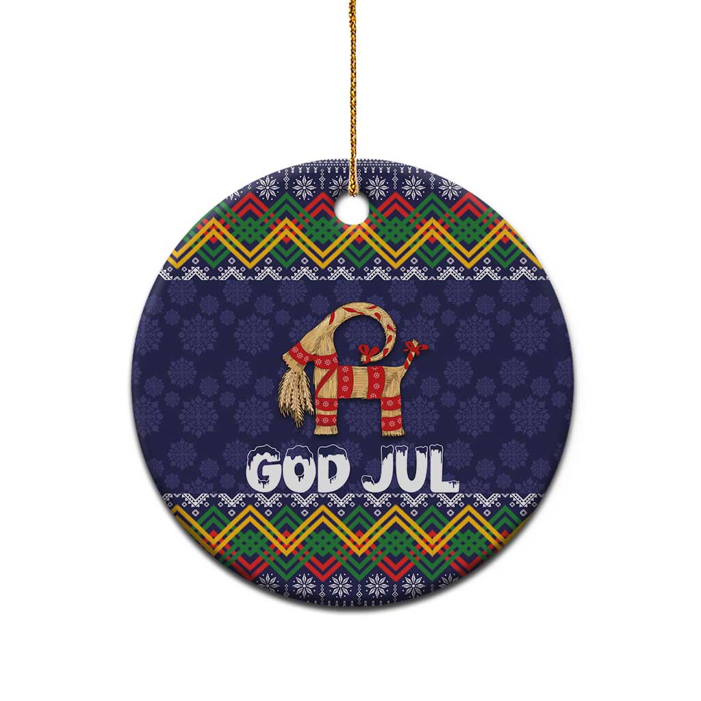 Dark blue round ceramic Christmas ornament with folk pattern, goat, and “GOD JUL” text