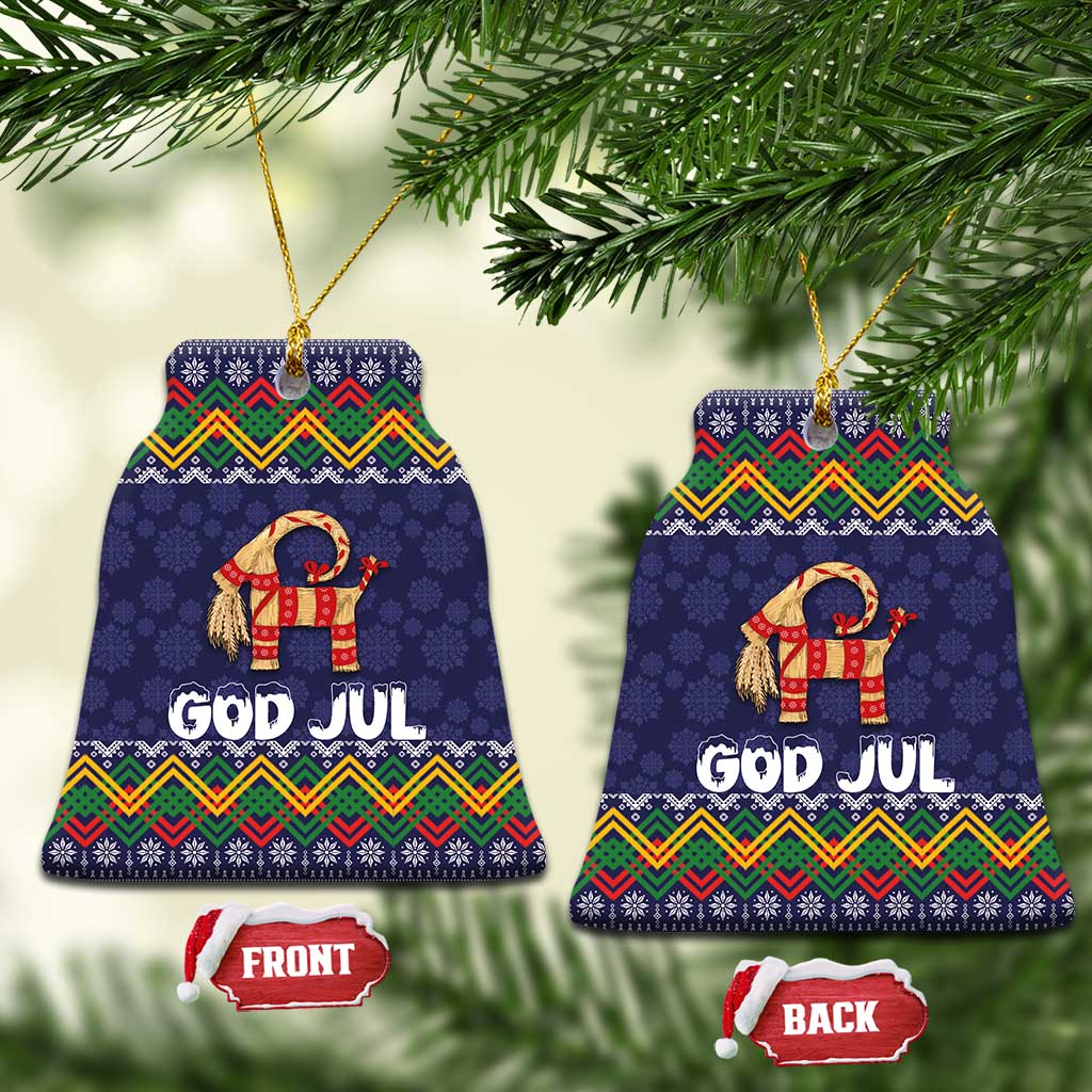Set of two dark blue bell-shaped ceramic ornaments with goat and “GOD JUL” folk pattern