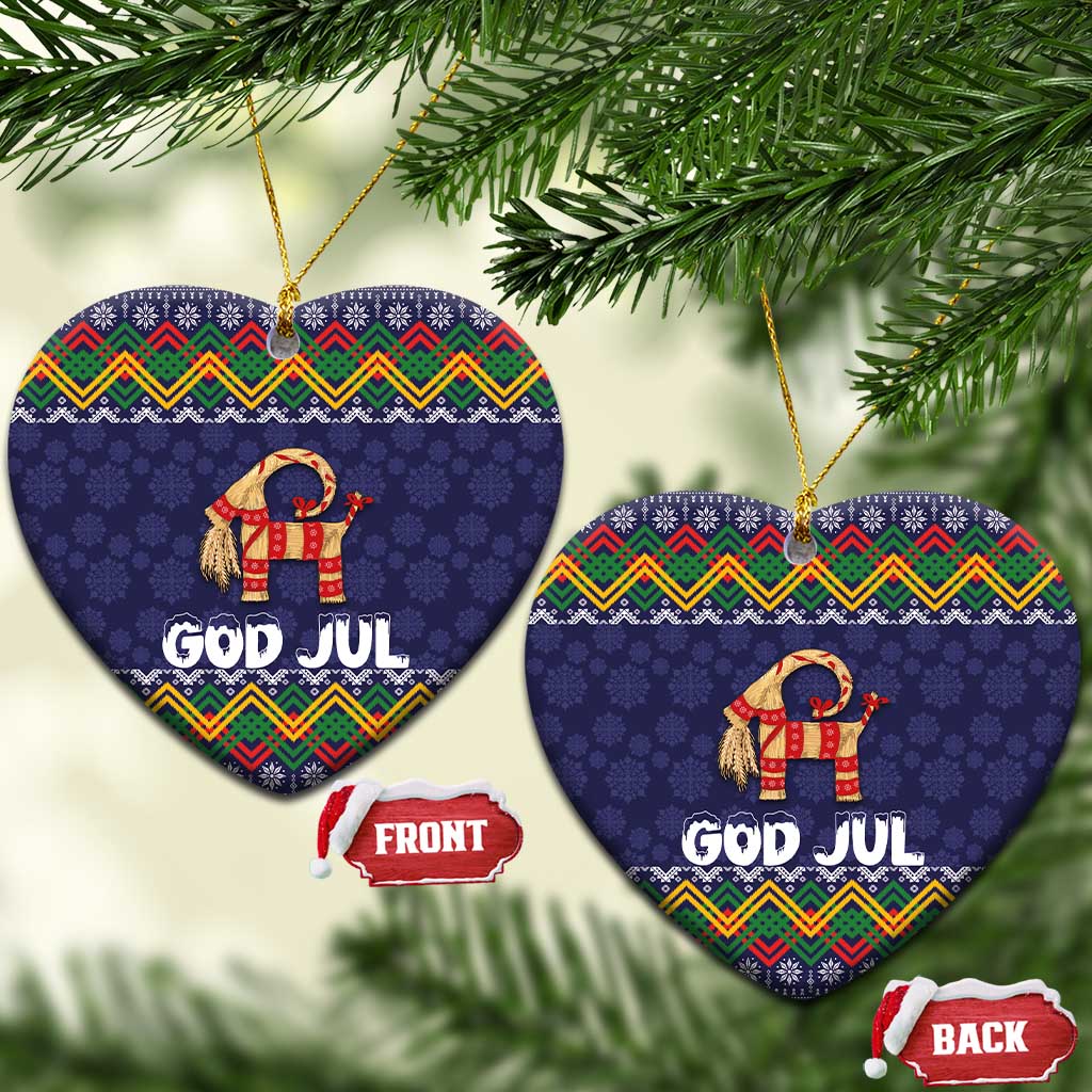 Set of two dark blue heart-shaped ceramic ornaments with goat and “GOD JUL” folk pattern