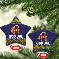 Set of two dark blue star-shaped ceramic ornaments with goat and “GOD JUL” folk design