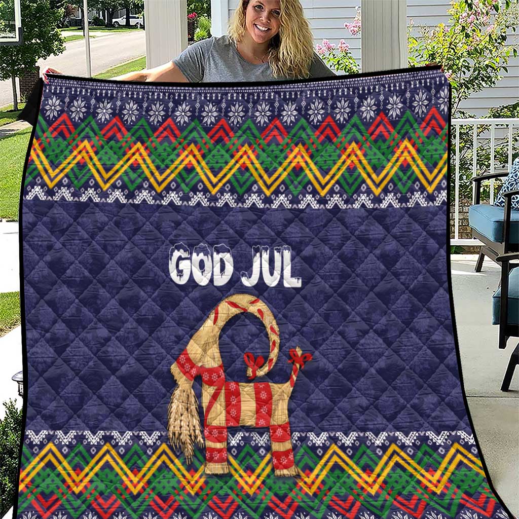 Dark blue Christmas quilt with quilted texture, “God Jul” text, and goat motif