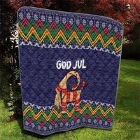 Dark blue quilt blanket with “God Jul” lettering, goat figure, and folk pattern band trim