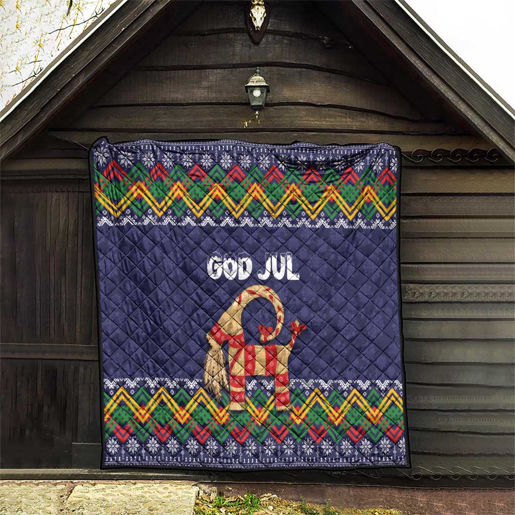 Dark blue quilt with “God Jul” goat figure and multicolor zigzag folk trim