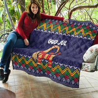 Dark blue quilt blanket with “God Jul” and goat motif, colorful chevrons and border patterns