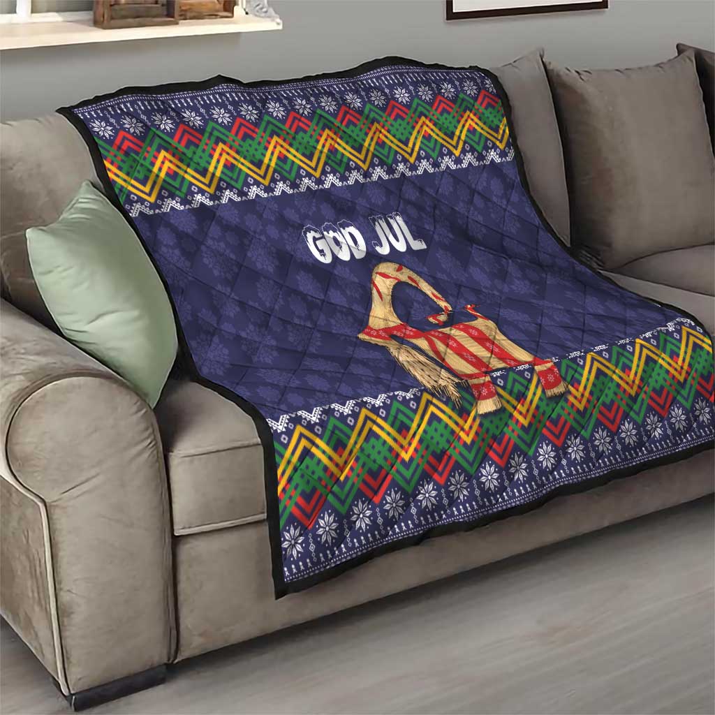 Dark blue quilt throw with “God Jul” goat motif and multicolor zigzag border