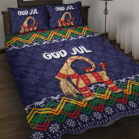 Dark blue quilt bed set with two God Jul pillows and colorful goat figure