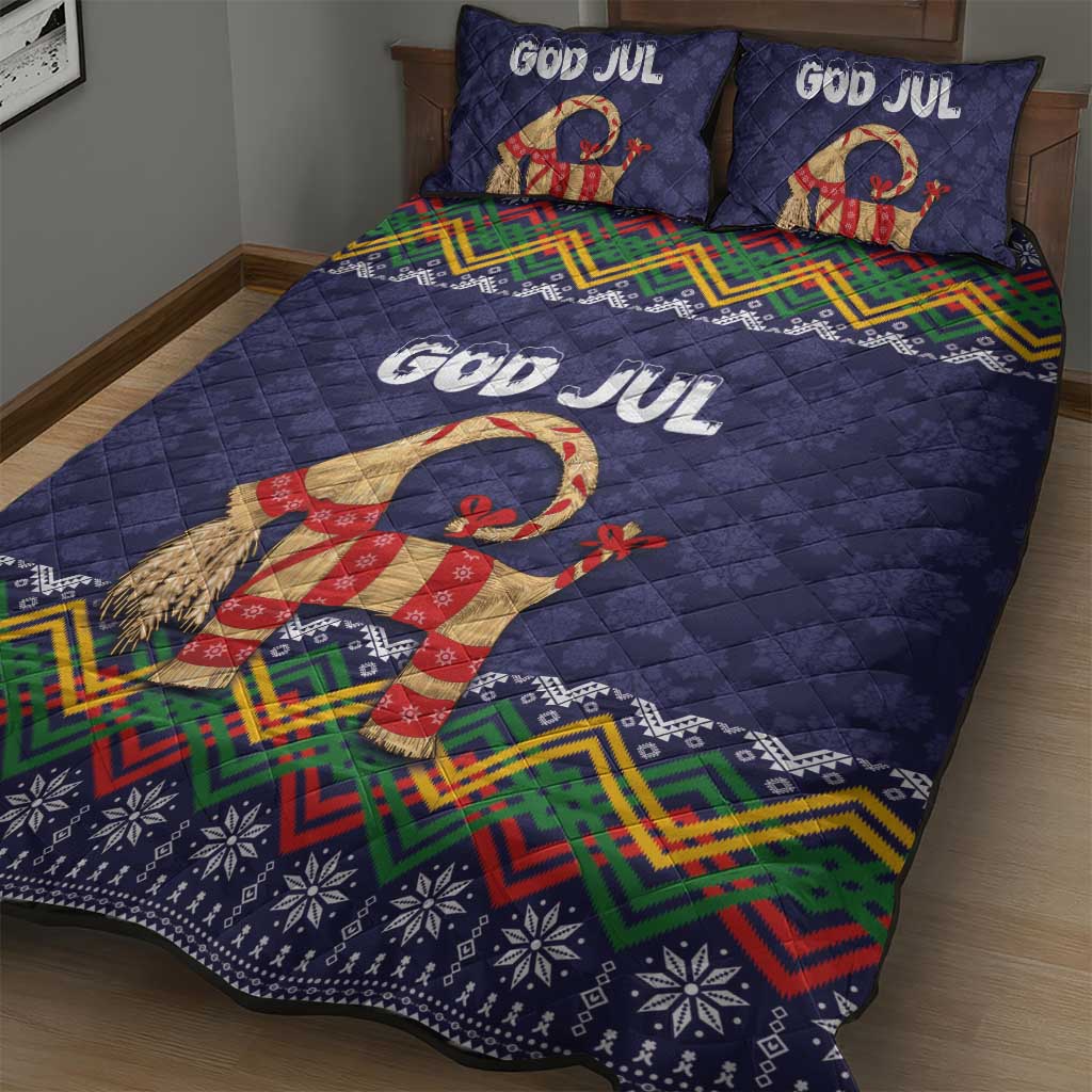Dark blue quilt bed set showing God Jul lettering, goat figure, and multicolor geometric border