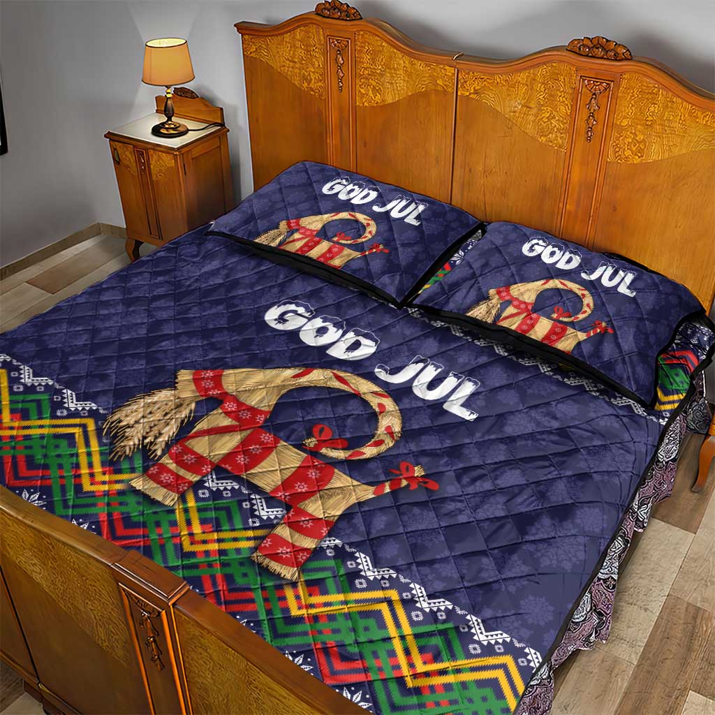 Dark blue quilt bed set with two pillows featuring God Jul text and a dressed goat