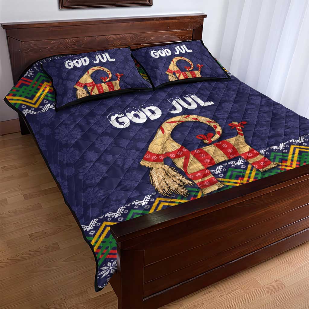 Dark blue quilt bed set with two God Jul pillows and colorful goat motif