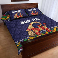Dark blue quilt bed set with two God Jul pillows and colorful goat motif