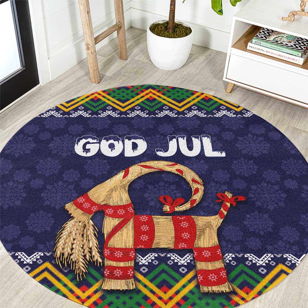 Dark blue round Christmas rug with 'GOD JUL' text, goat figure, colorful folk border