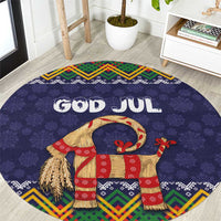 Dark blue round Christmas rug with 'GOD JUL' text, goat figure, colorful folk border