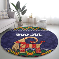 Dark blue round Christmas rug with 'GOD JUL' and red gift-clad goat figure
