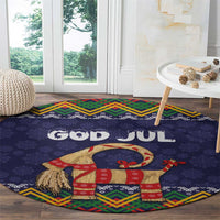 Dark blue round Christmas rug with 'GOD JUL' text and colorful goat-and-gifts pattern
