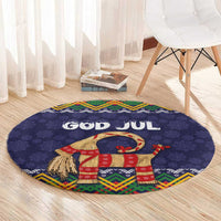 Dark blue round Christmas rug featuring 'GOD JUL' and a red gift goat with fringe