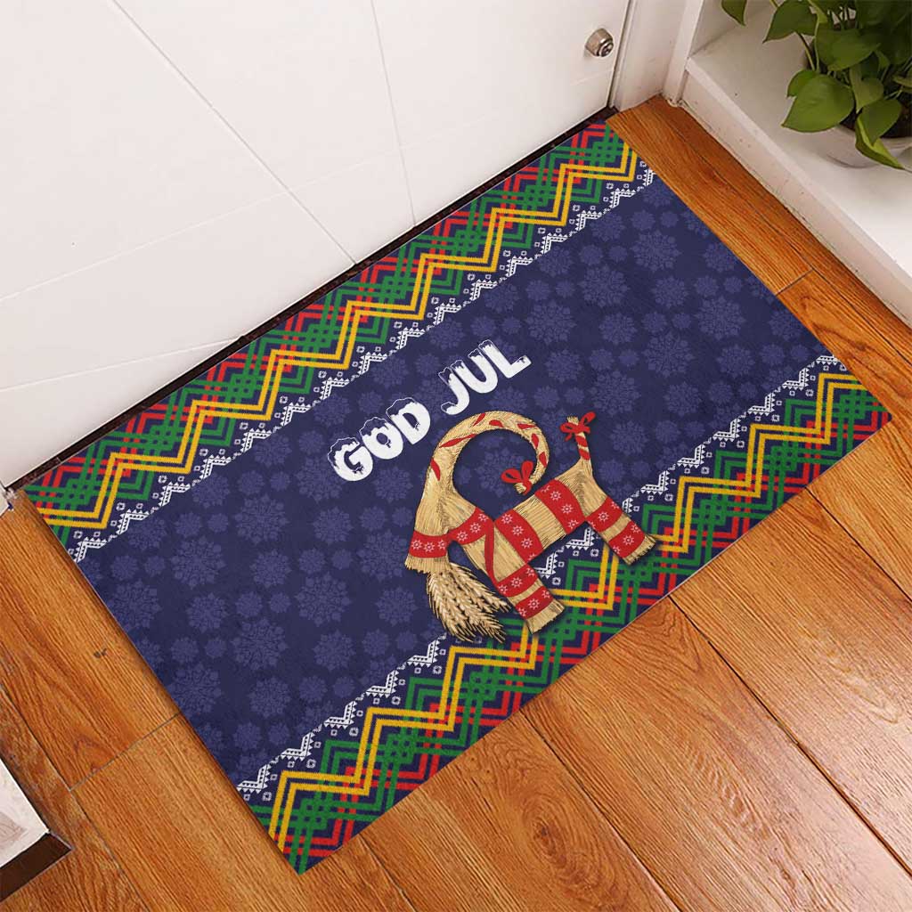 Dark blue Christmas rubber doormat on floor corner with God Jul goat and zigzag trim