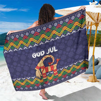 Dark blue Christmas sarong with folk zigzag border and goat graphic, “GOD JUL” text