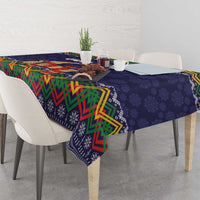 Dark blue tablecloth with colorful zigzag edge and small snowflake-like folk motifs