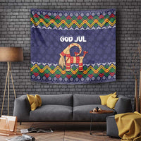 Dark blue tapestry with 'GOD JUL' and dressed goat, zigzag folk border