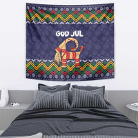 Dark blue tapestry with 'GOD JUL' goat center and multicolor zigzag folk border