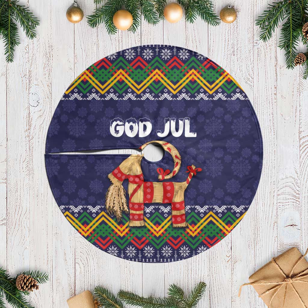 Dark blue Christmas tree skirt with round "GOD JUL" center and folk goat design
