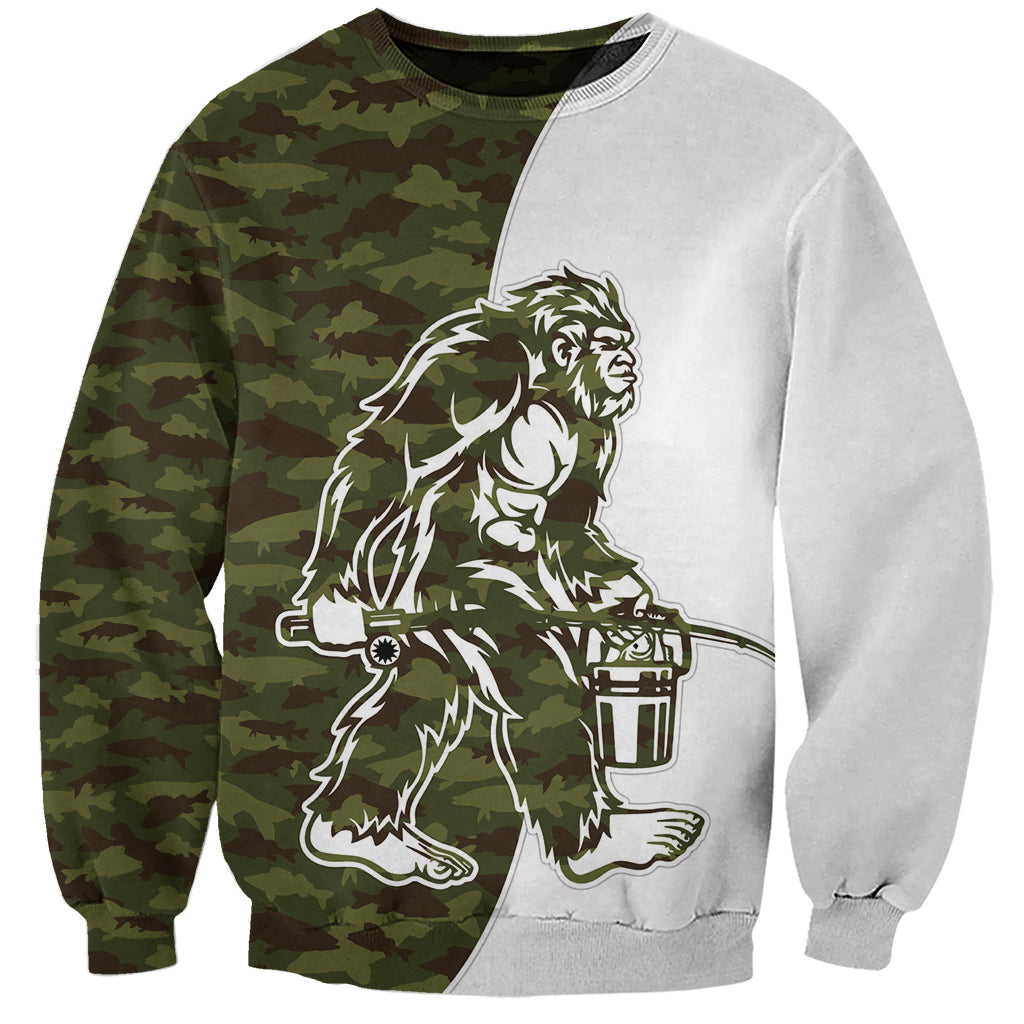 Unisex crewneck sweatshirt with camouflage panel and Bigfoot holding fish graphic, long sleeves