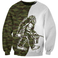 Unisex crewneck sweatshirt with camouflage panel and Bigfoot holding fish graphic, long sleeves
