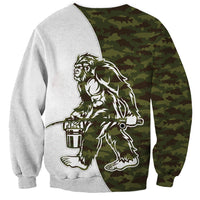 Unisex crewneck sweatshirt with camouflage panel and Bigfoot hand-held object graphic, long sleeves