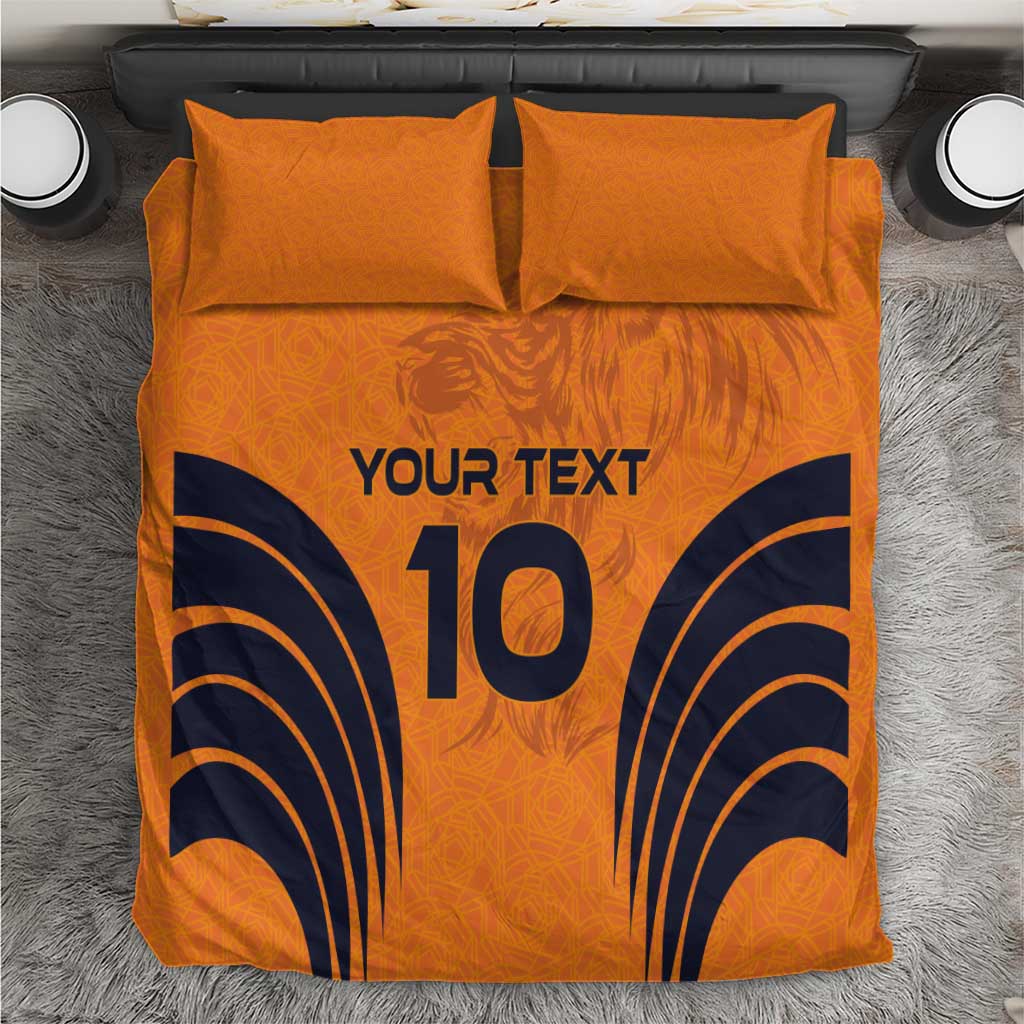 Orange duvet cover and two matching pillowcases with 'YOUR TEXT' and large '10' print