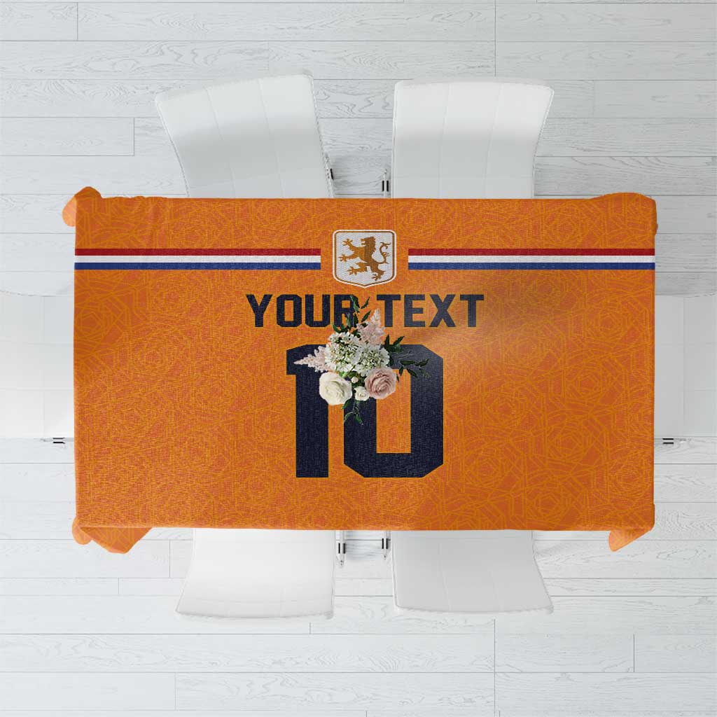 Orange custom football tablecloth, blue side stripe, crest and "YOURTEXT" centerpiece.