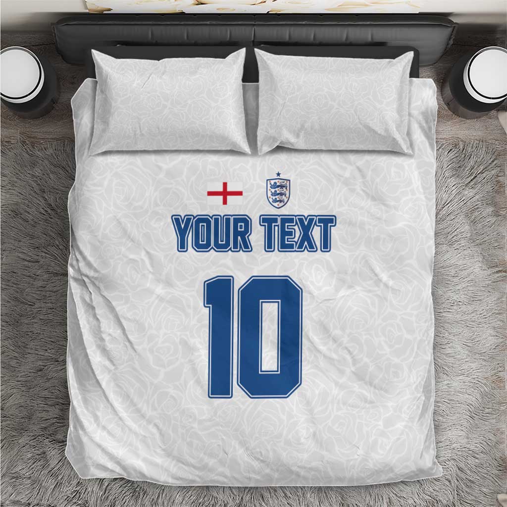 White bedding set with two pillows and duvet featuring blue “YOUR TEXT” and number 10