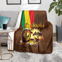 Deep brown Ethiopia blanket on light rug, flag stripe and coffee-themed wildlife image