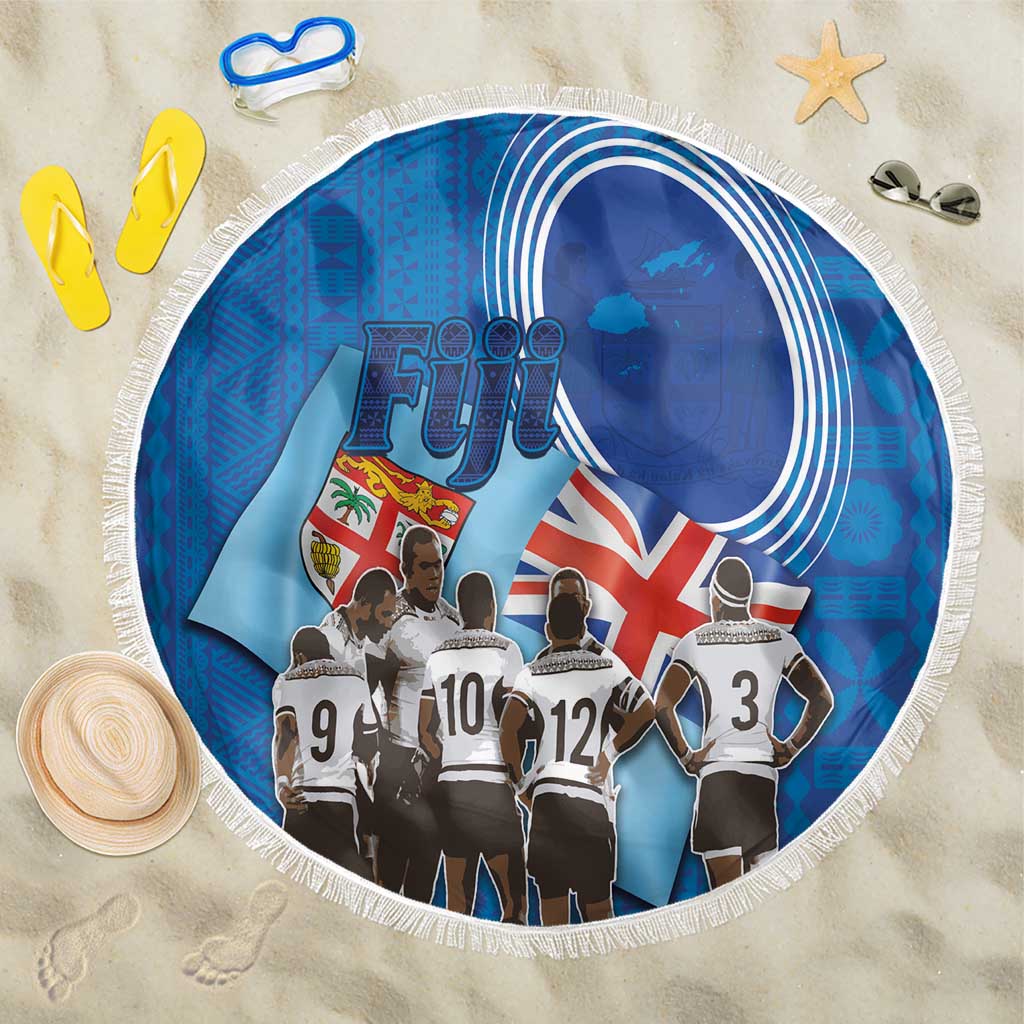Round blue beach blanket with white fringe and Fiji rugby sevens players graphic