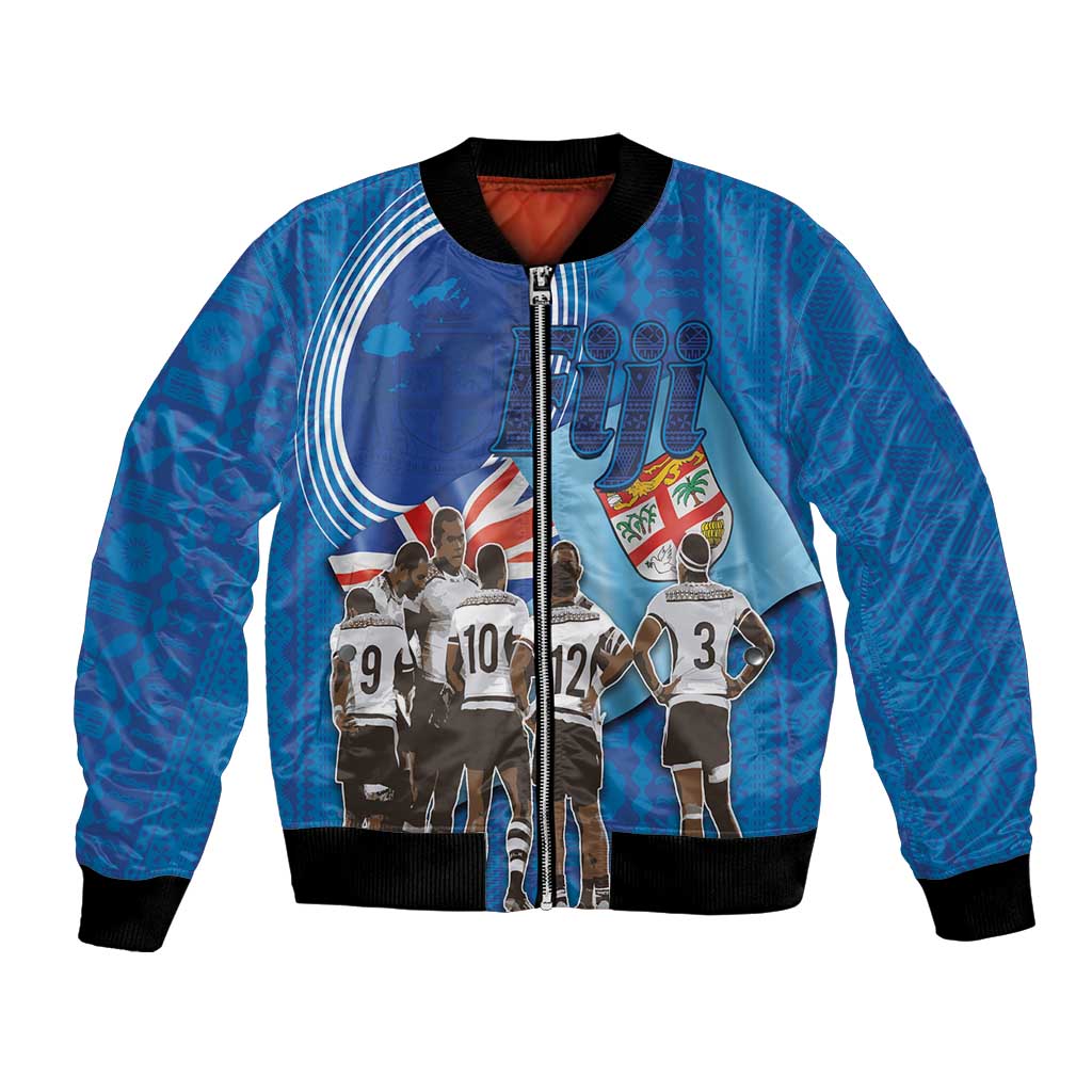 Blue rugby bomber jacket with full-zip front and ribbed cuffs; team graphic on front