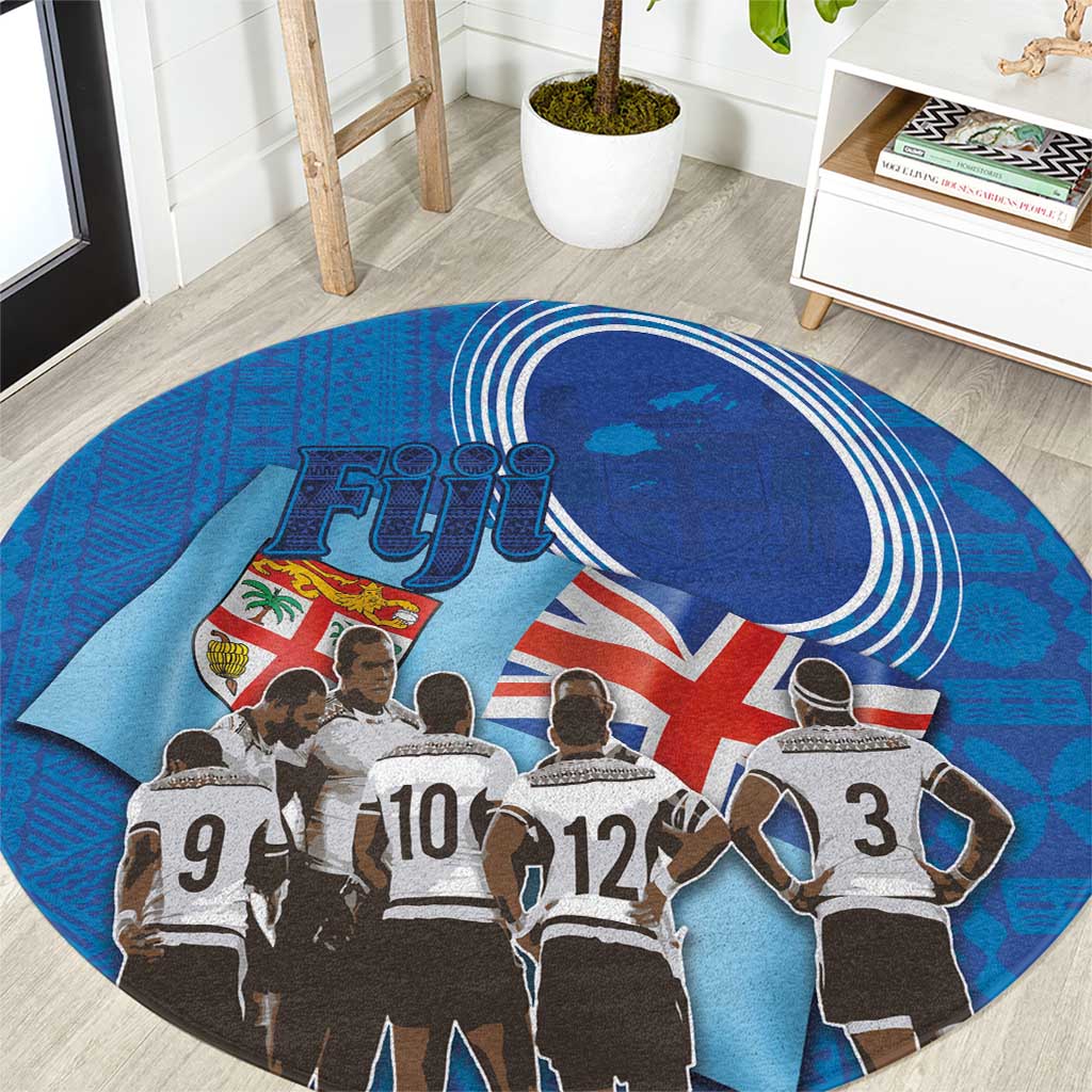Blue round rugby carpet with Fiji text, Union Jack style flag and rugby players