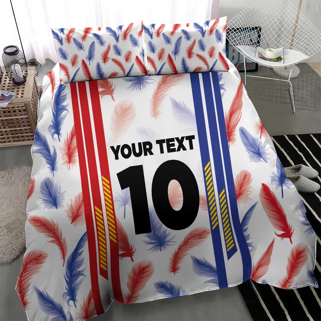 Bedding set with feather-and-striped duvet cover showing custom “YOUR TEXT” 10 and matching pillowcases