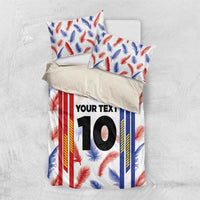 Bedding set with white duvet and feather print; two pillowcases with matching custom “YOUR TEXT” 10