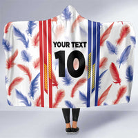 Hooded blanket with feather pattern and red/blue vertical stripes, 'YOUR TEXT' 10 center