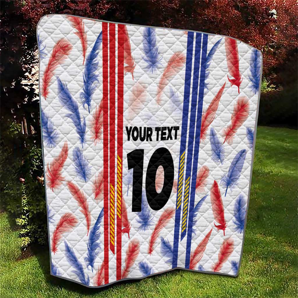 White quilt blanket with red and blue maple leaf print, “YOUR TEXT”, and number 10