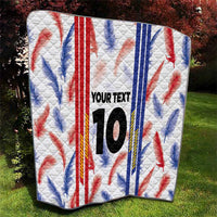 White quilt blanket with red and blue maple leaf print, “YOUR TEXT”, and number 10
